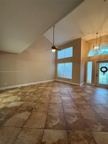 a view of an empty room with glass door