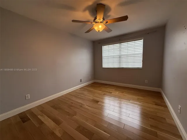 a bathroom with a sink mirror and toilet