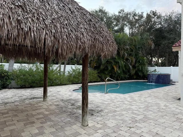 swimming pool view with a outdoor seating