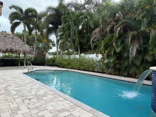 a view of a house with a yard and garage