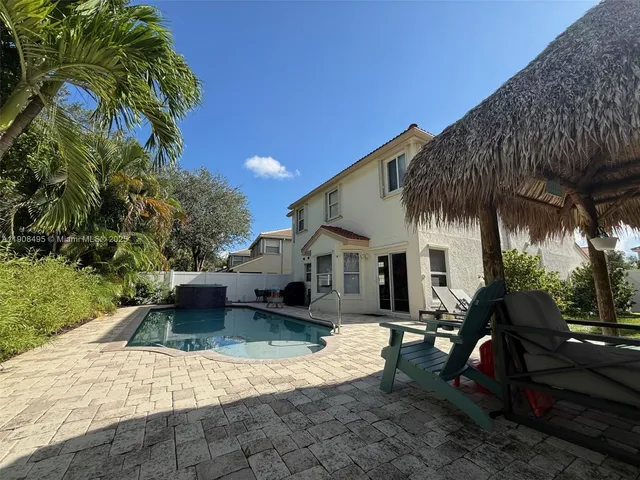 a view of a front of a house with a yard