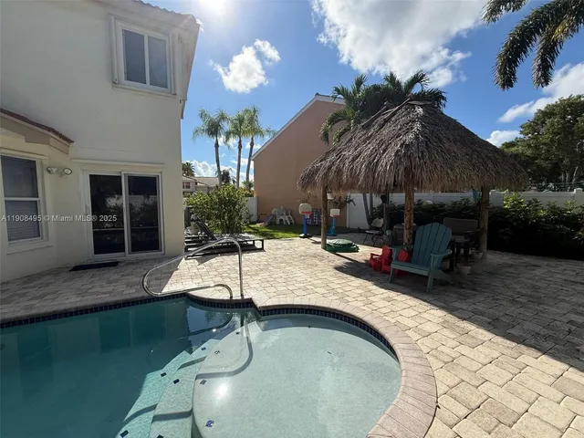 a house view with a sitting space and garden space