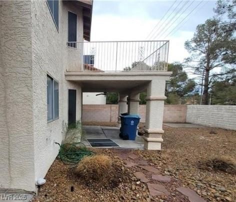 2813 Cacto Court Henderson, NV 89074 - Photo 11 of 28 View of vehicle parking with a fenced backyard and ceiling fan