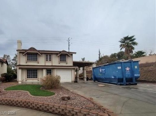 2813 Cacto Court Henderson, NV 89074 - Photo 3 of 28 View of front of home featuring concrete driveway, a chimney, and stucco siding