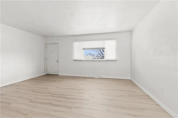 an empty room with a bench