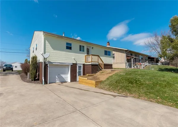 a front view of a house with a garage