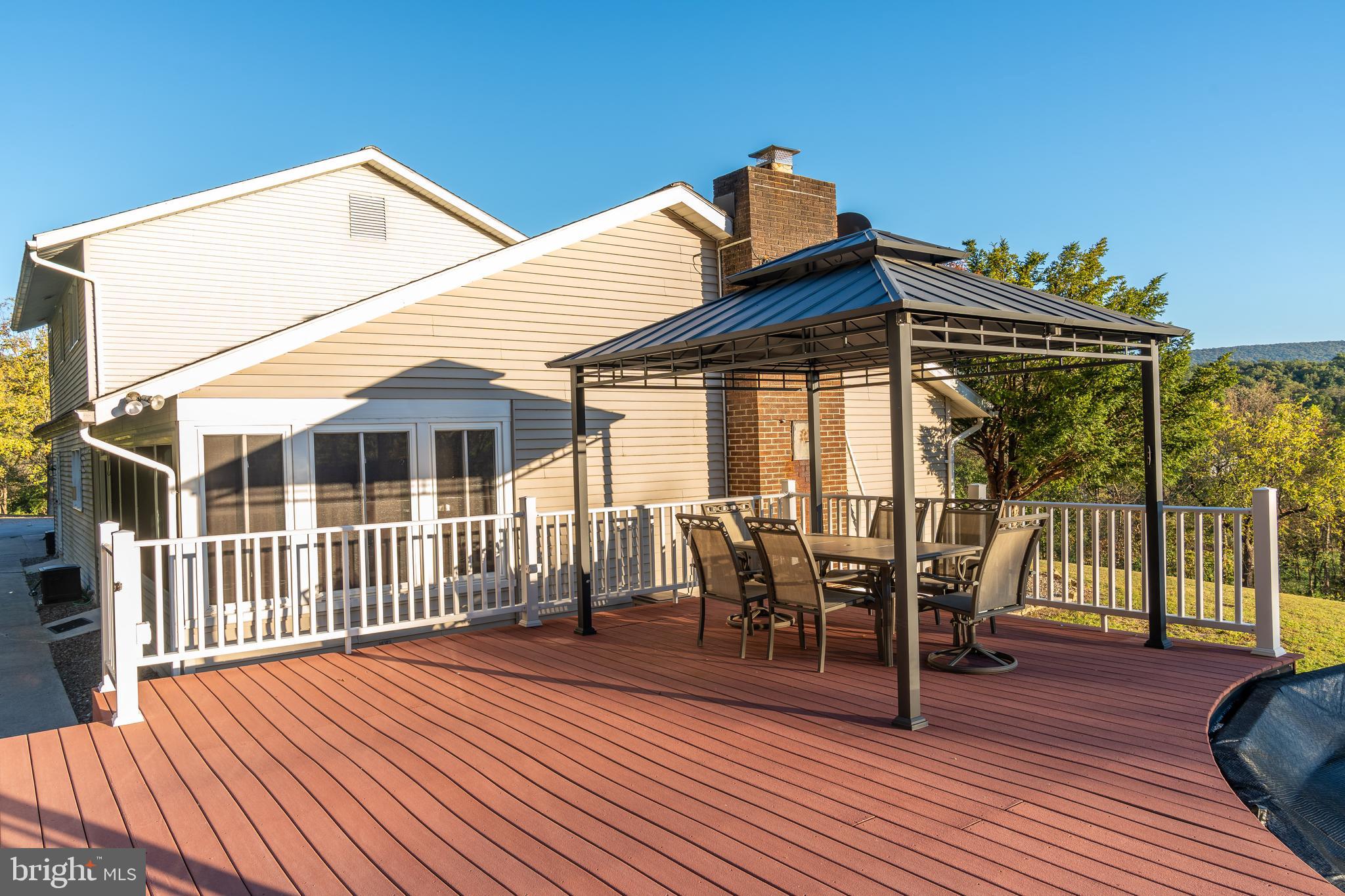 105 Shrefflers Lane McClure, PA 17841 - Photo 12 of 48 a view of a house with a deck