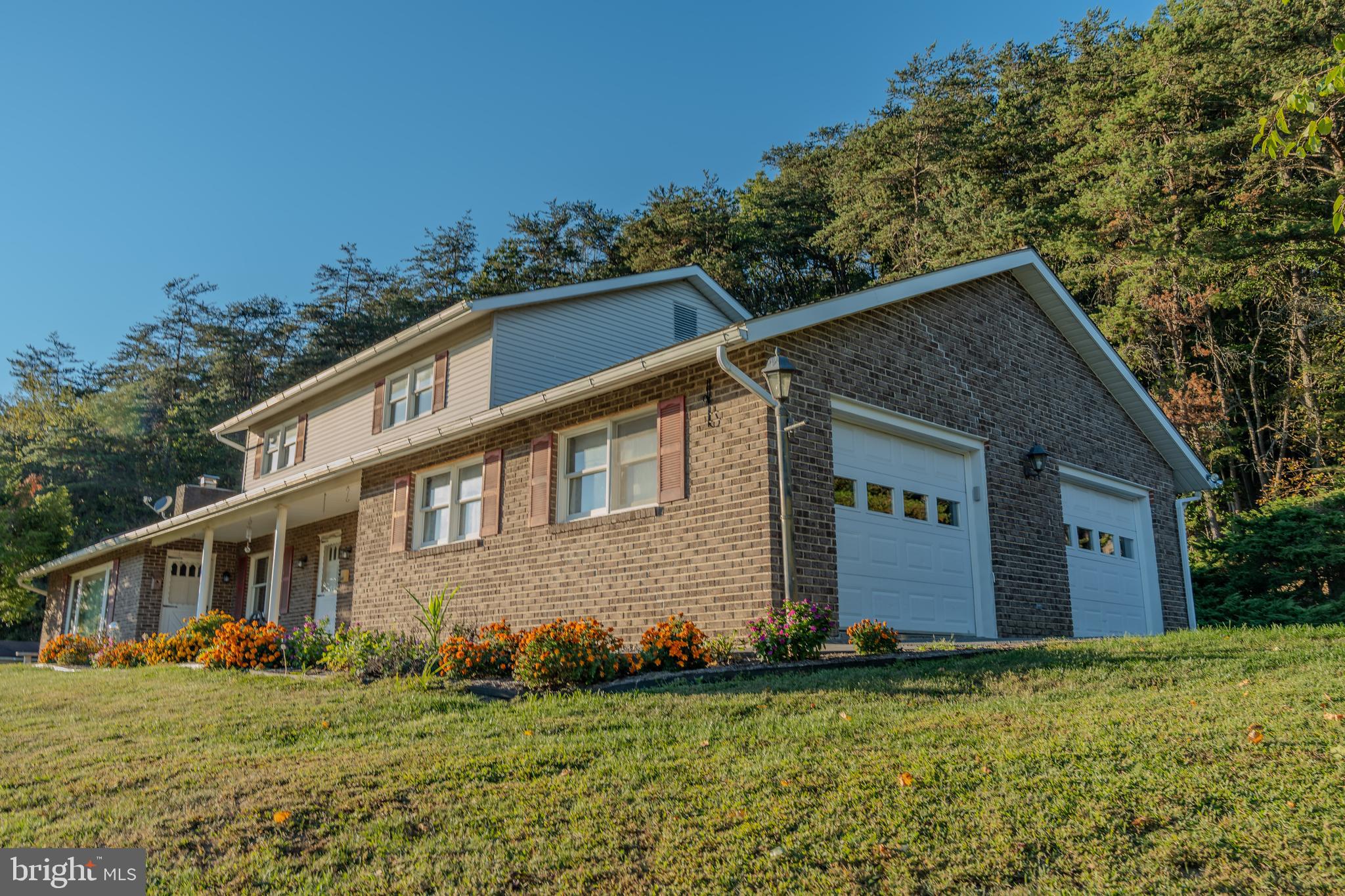 105 Shrefflers Lane McClure, PA 17841 - Photo 16 of 48 a front view of house with yard and trees in the background