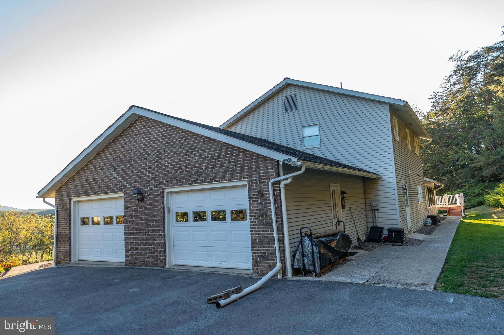 105 Shrefflers Lane McClure, PA 17841 - Photo 17 of 48 a front view of a house with a garage