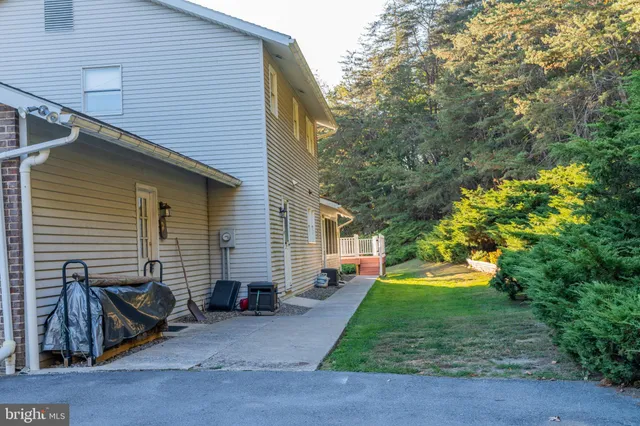 a backyard of a house with lots of green space
