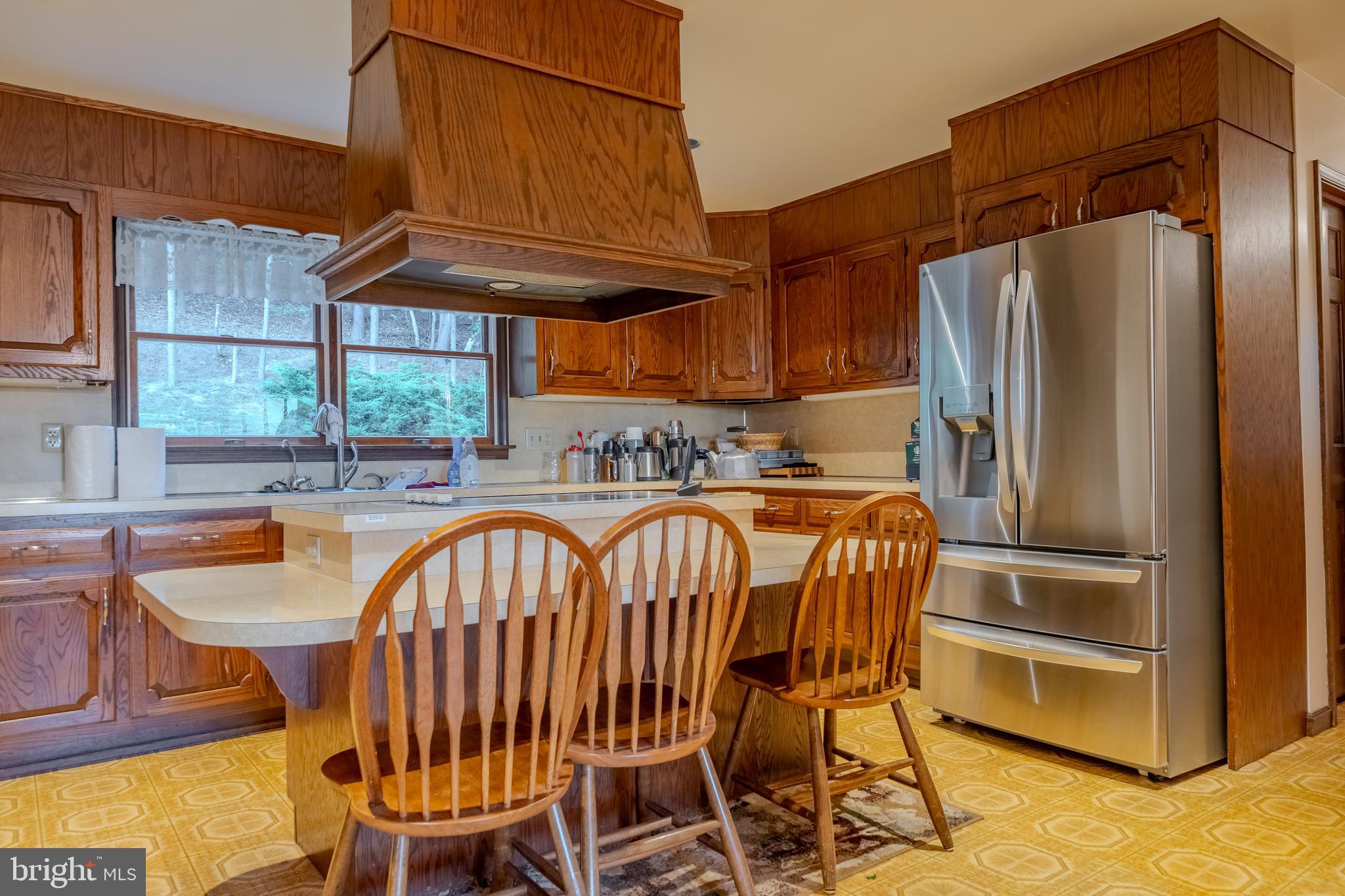 105 Shrefflers Lane McClure, PA 17841 - Photo 29 of 48 a kitchen with stainless steel appliances a refrigerator a table and chairs