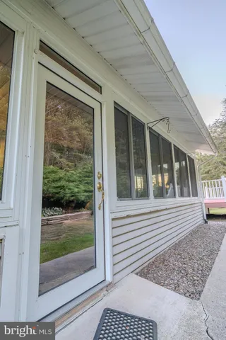 a view of a livingroom with wooden floor and a window