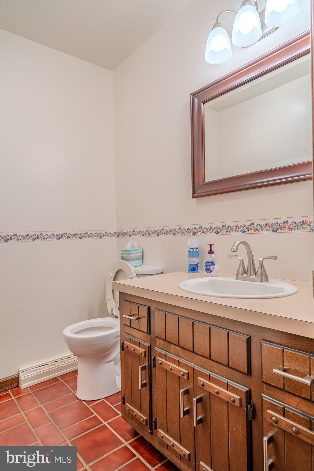 105 Shrefflers Lane McClure, PA 17841 - Photo 39 of 48 a bathroom with a sink a toilet and a mirror