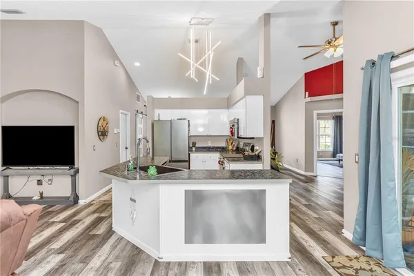 a kitchen with a sink stove and refrigerator