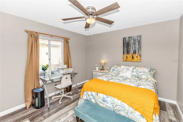 a bed room with a bed and a chandelier