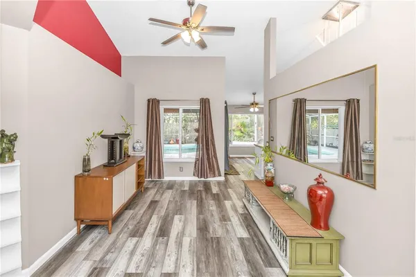 a spacious bedroom with a bed and window