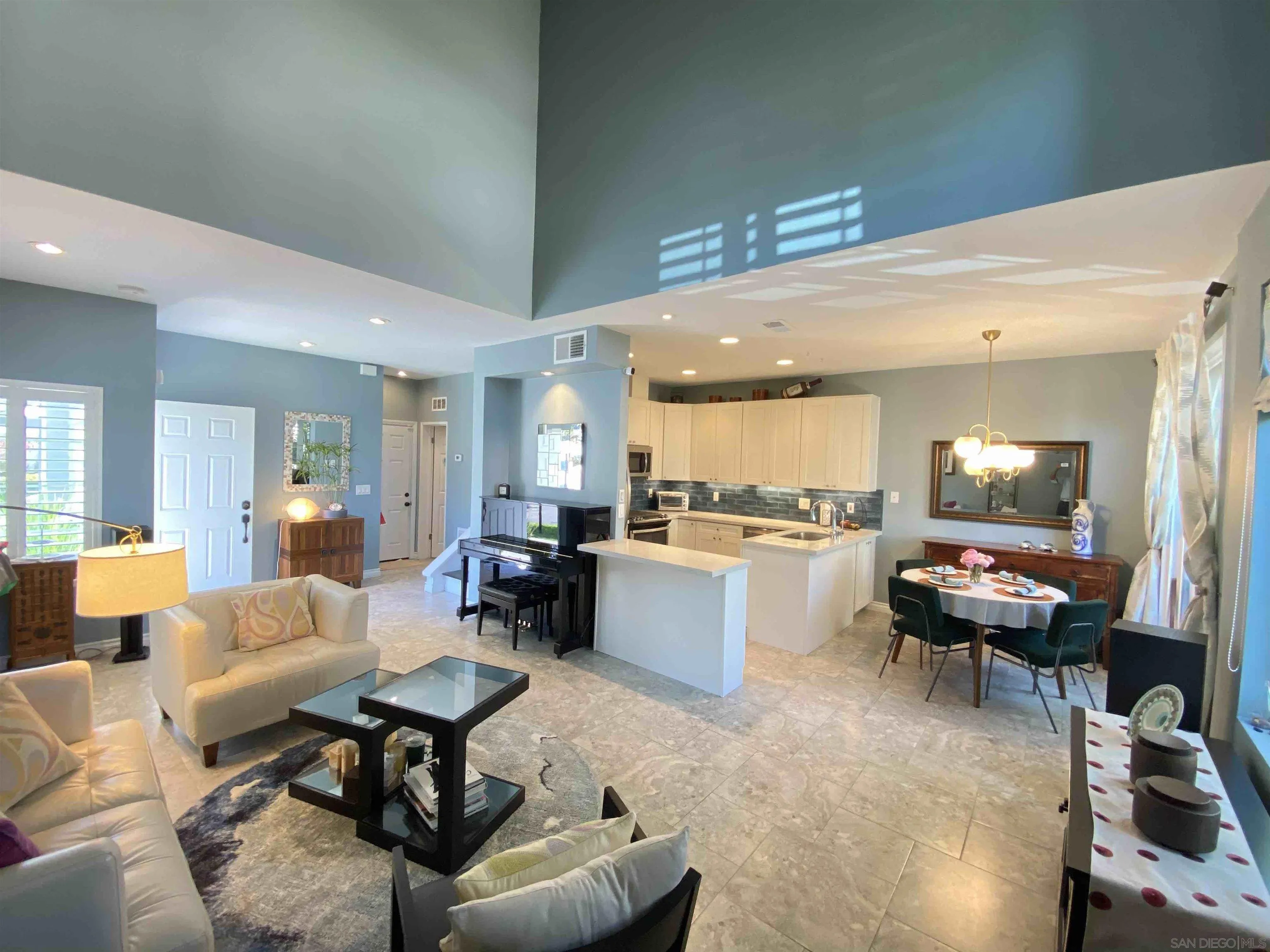 13319 Kibbings Road San Diego, CA 92130 - Photo 11 of 32 a living room with furniture and kitchen view