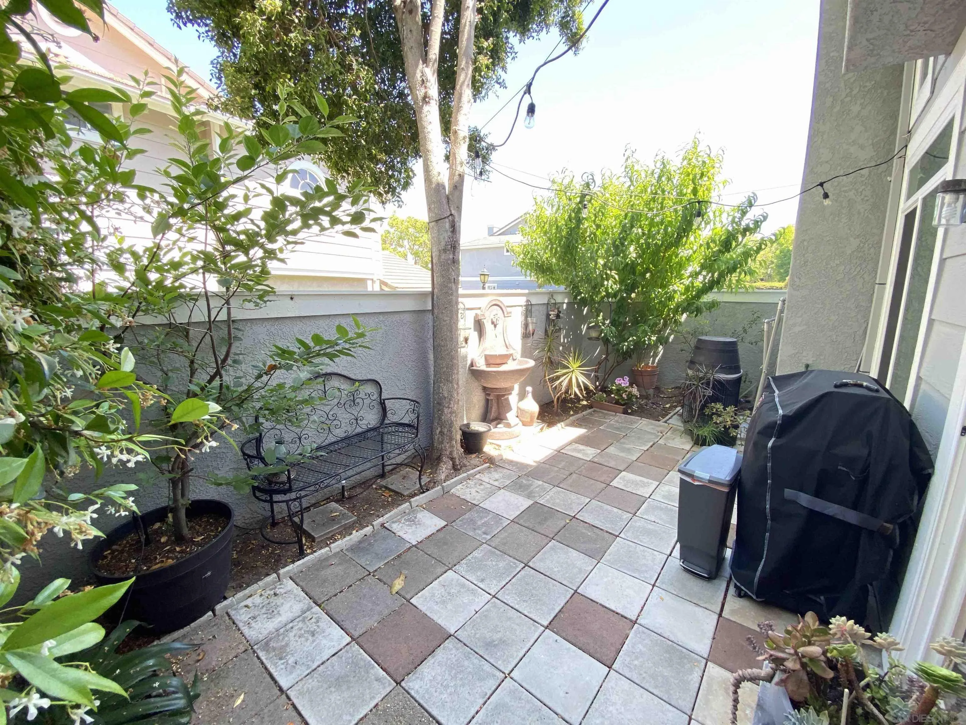 13319 Kibbings Road San Diego, CA 92130 - Photo 16 of 32 a view of a porch with chairs and potted plants