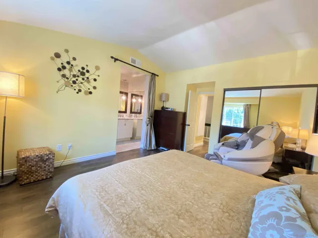 a bedroom with a bed and a couch