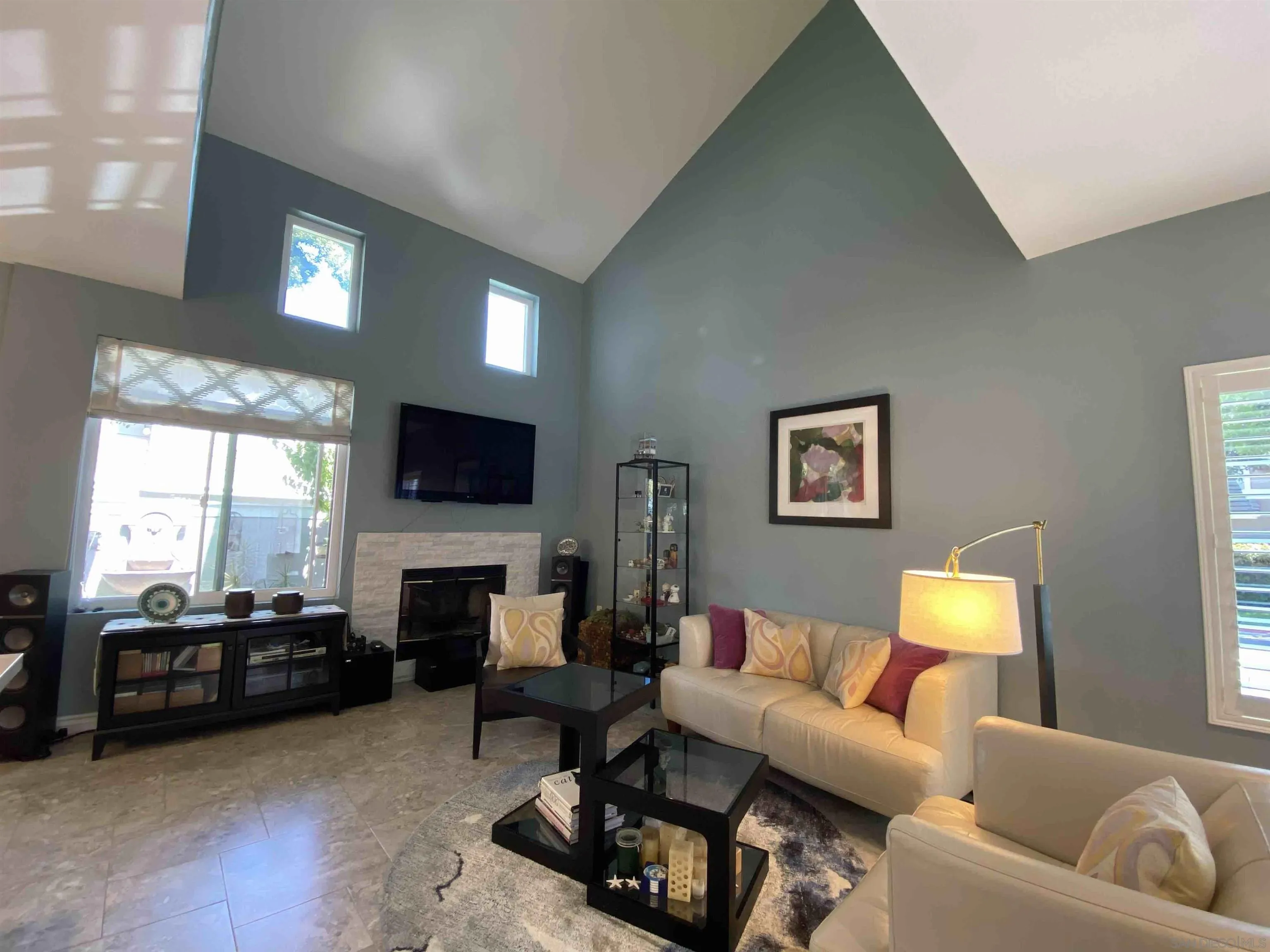 13319 Kibbings Road San Diego, CA 92130 - Photo 6 of 32 a living room with furniture and a flat screen tv