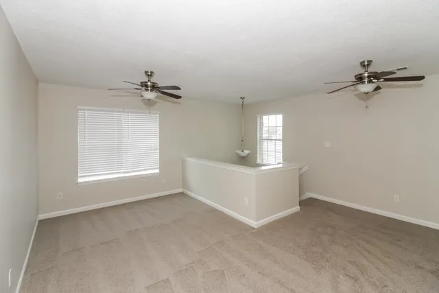 a view of a room with a air conditioner and window