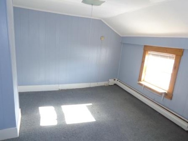 72 Pulaski Street Ware, MA 01082 - Photo 4 of 15 an empty room with a window