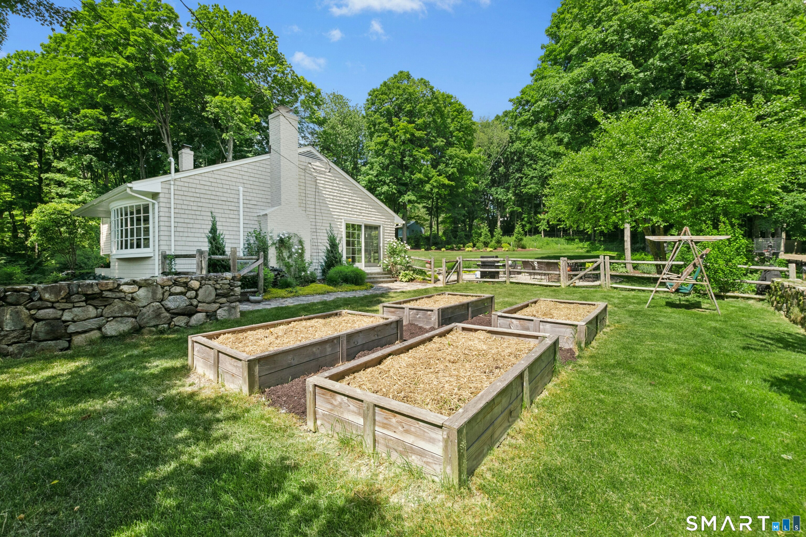 29 Old Farm Road Weston, CT 06883 - Photo 7 of 10 Another perspective of the gardens looking towards the patio.