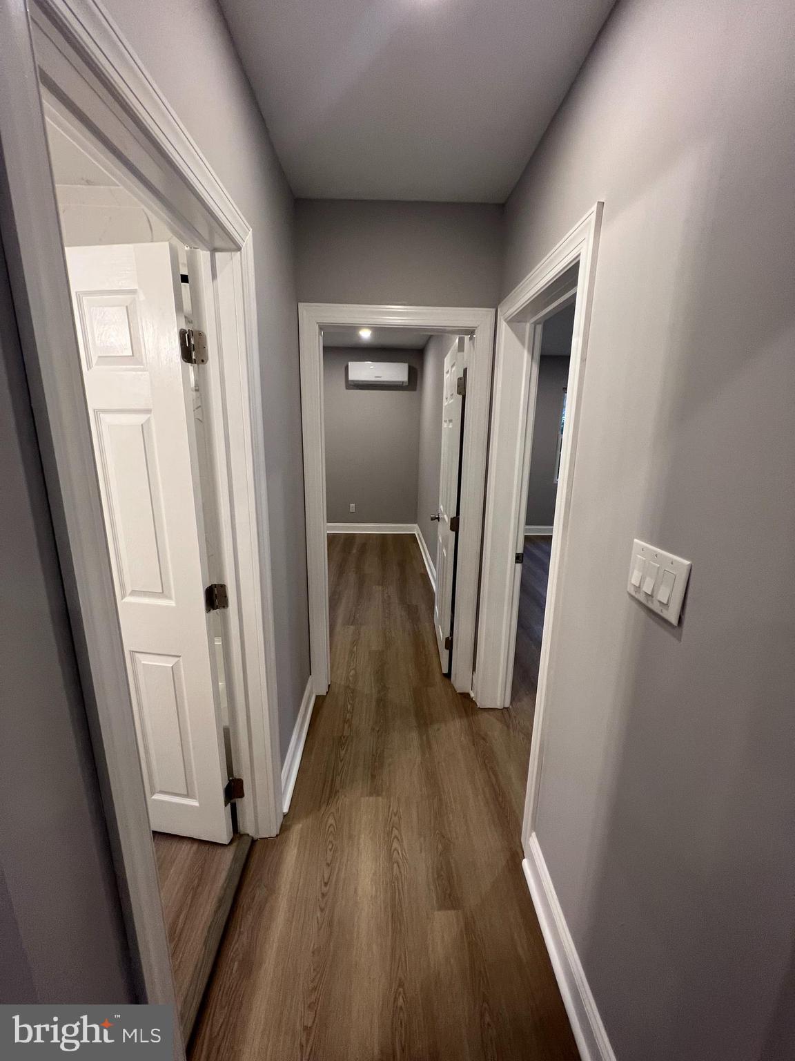 1301 Newton Avenue, Unit A Haddon Township, NJ 08107 - Photo 11 of 13 a view of a hallway with wooden floor and staircase