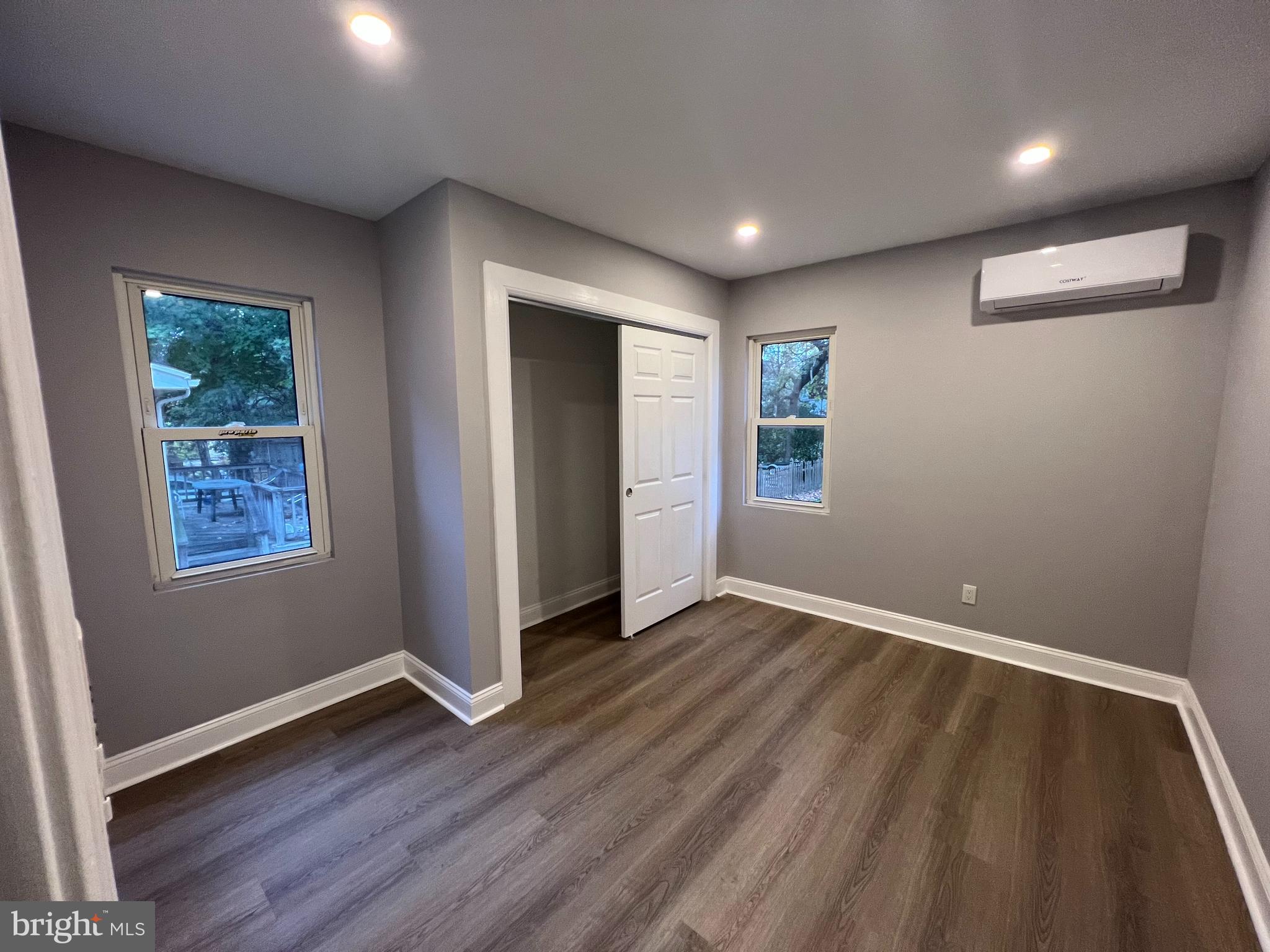 1301 Newton Avenue, Unit A Haddon Township, NJ 08107 - Photo 13 of 13 a view of an empty room with wooden floor and a window