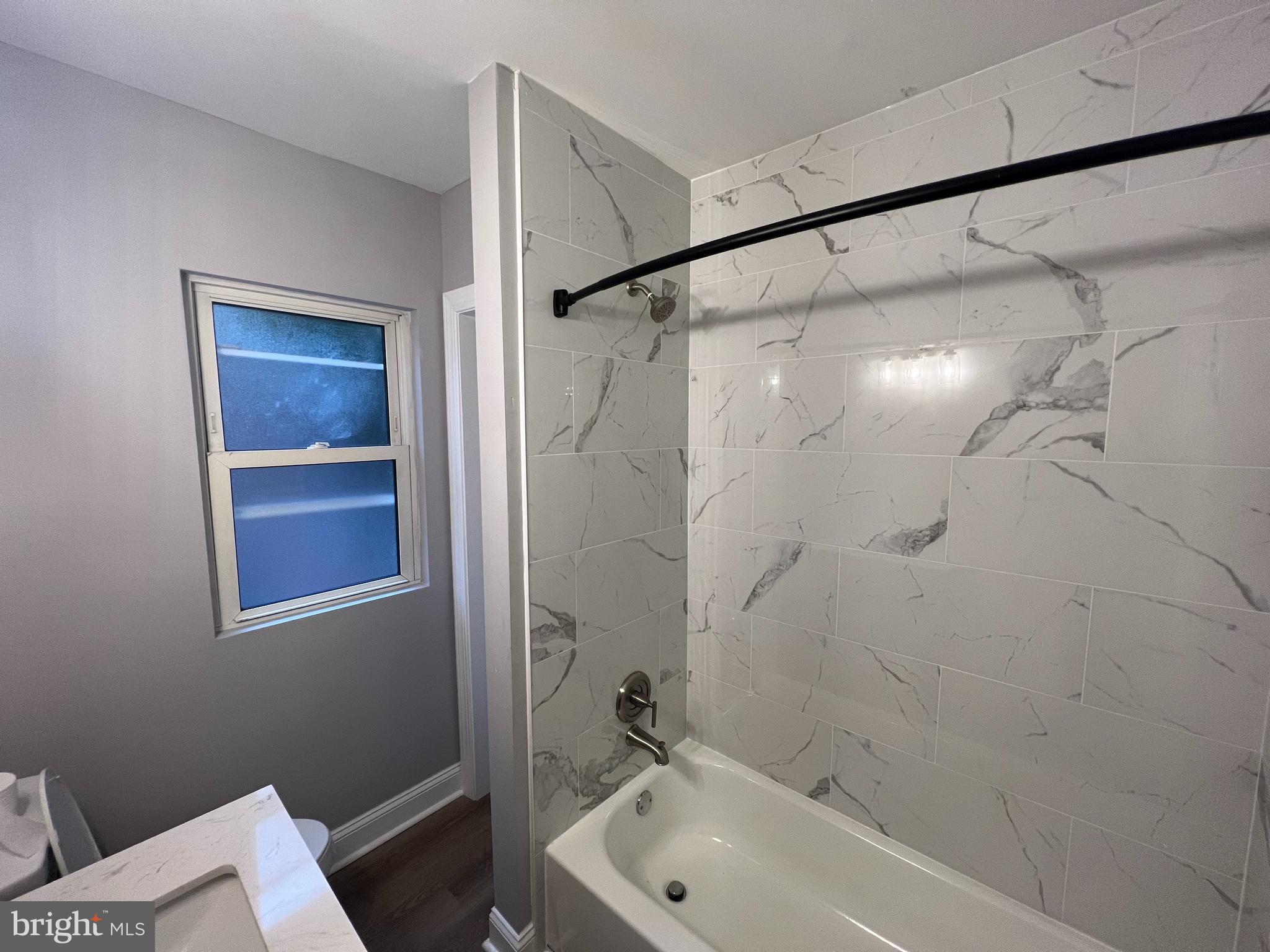 1301 Newton Avenue, Unit A Haddon Township, NJ 08107 - Photo 8 of 13 a bathroom with a tub and shower