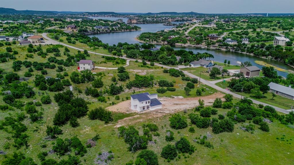 7108 Hells Gate Loop Strawn, TX 76475 - Photo 3 of 17 an aerial view of a city with lots of residential buildings