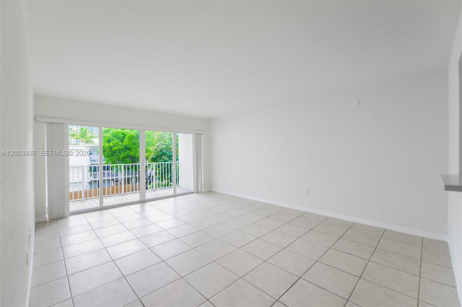 7737 Southwest 88th Street, Unit C312 Miami, FL 33156 - Photo 3 of 32 an empty room with windows