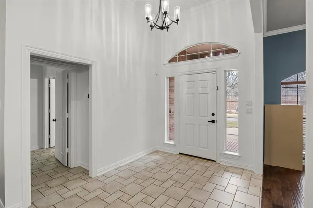 a view of a hallway to rooms