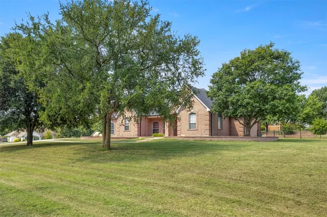 a large building with trees in front of it