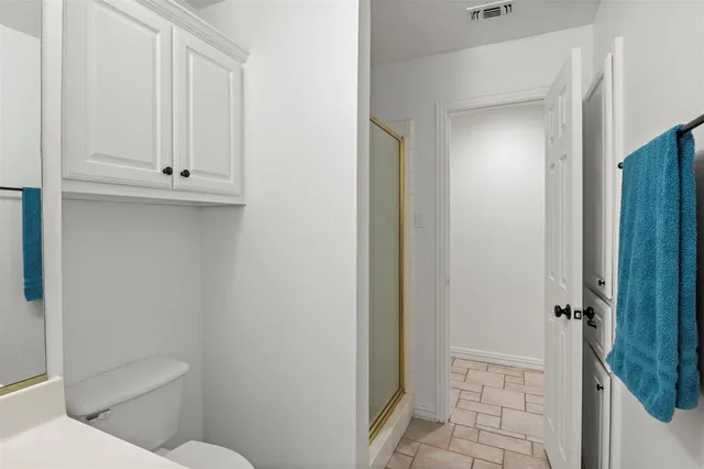 a bathroom with a granite countertop sink