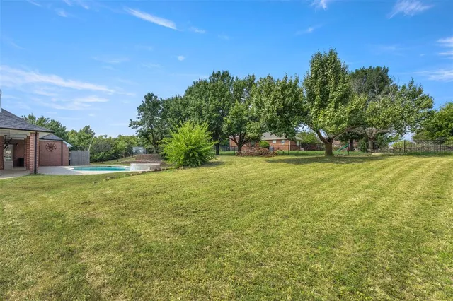 a view of a house with a big yard
