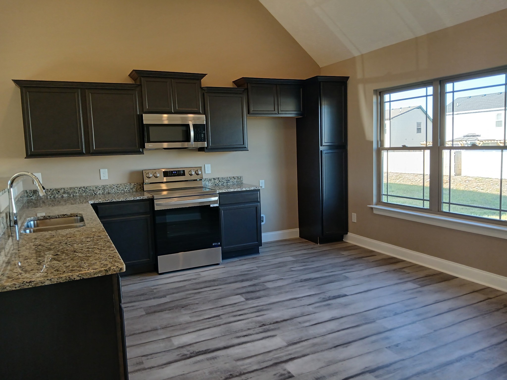 2819 Upstream Road Christiana, TN 37037 - Photo 11 of 95 a kitchen with stainless steel appliances granite countertop a stove a sink and a refrigerator