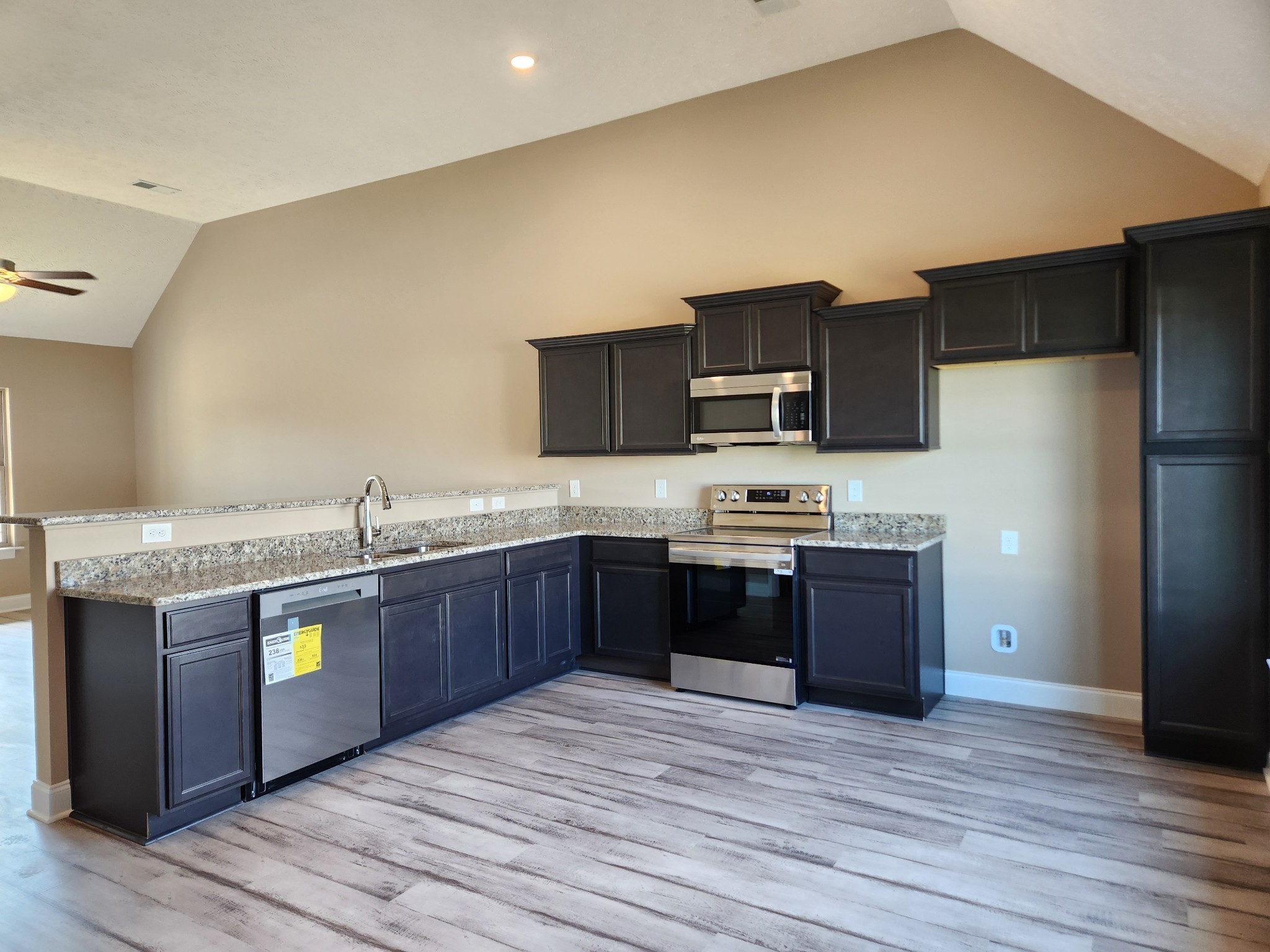 2819 Upstream Road Christiana, TN 37037 - Photo 13 of 95 a kitchen with stainless steel appliances granite countertop a stove a sink dishwasher a refrigerator and a oven with wooden floor