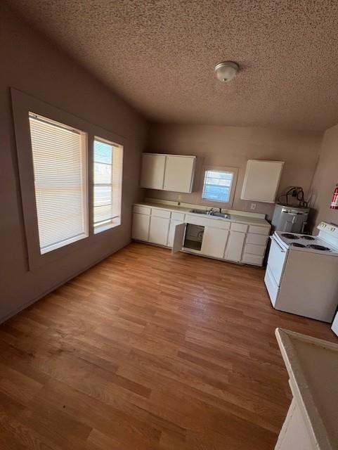 709 Grape Street, Unit A Abilene, TX 79601 - Photo 3 of 9 a view of a kitchen with microwave and cabinets