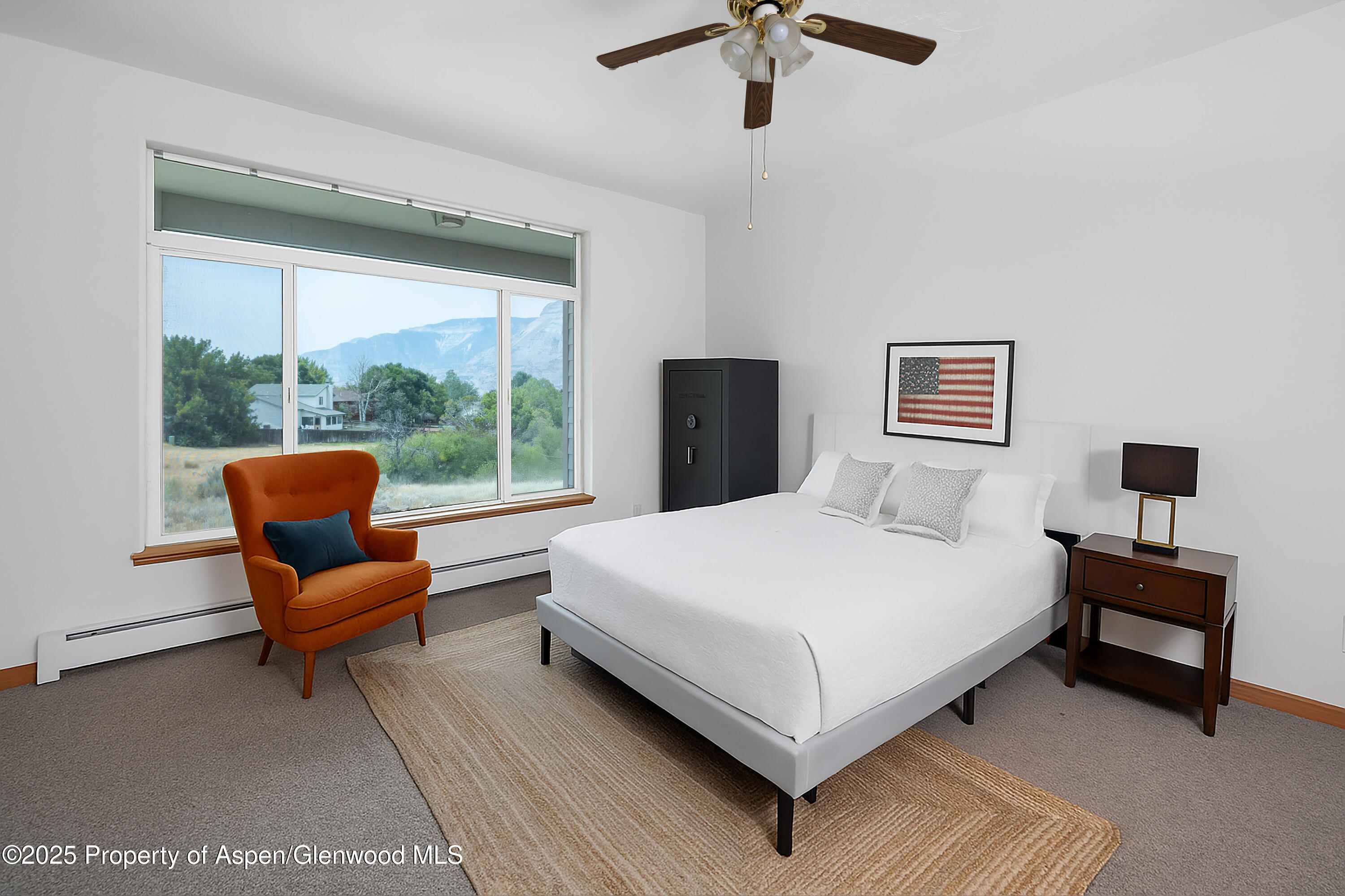 250 Limberpine Circle Battlement Mesa, CO 81635 - Photo 16 of 34 a bedroom with a bed and a couch