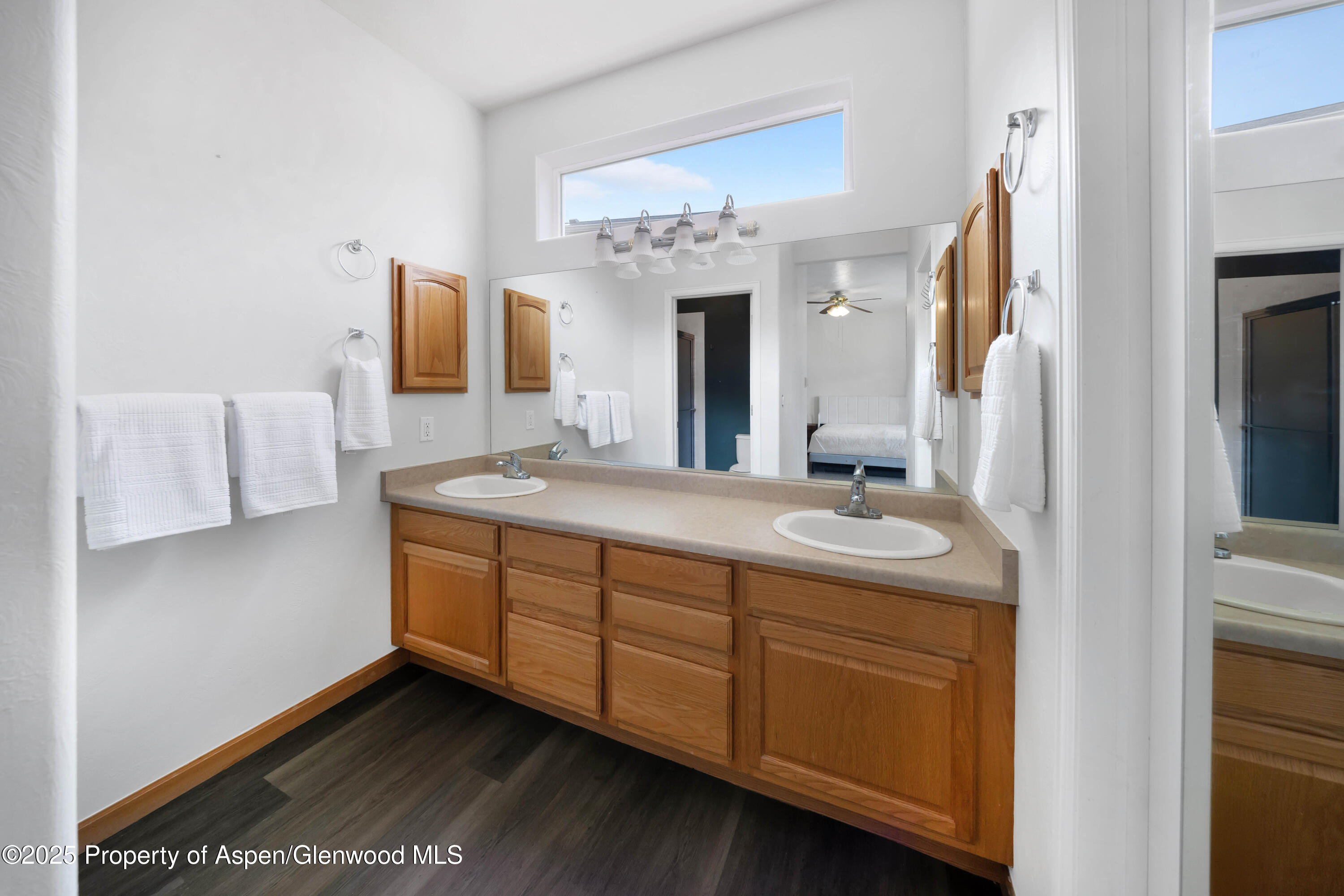 250 Limberpine Circle Battlement Mesa, CO 81635 - Photo 26 of 34 a bathroom with a double vanity sink and a mirror