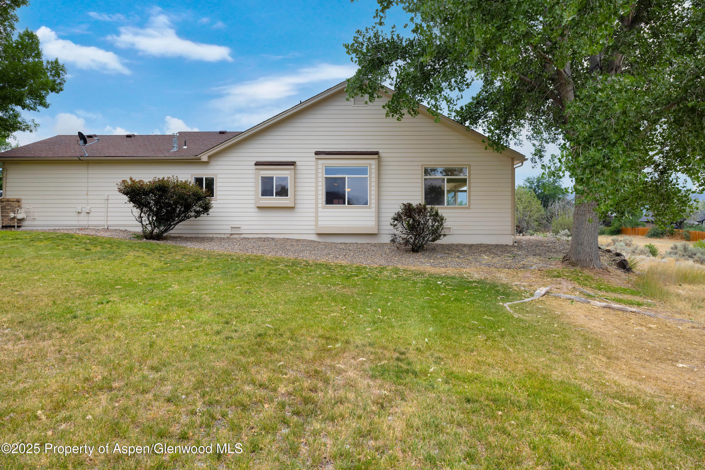 250 Limberpine Circle Battlement Mesa, CO 81635 - Photo 27 of 34 a view of a house with a yard and sitting area