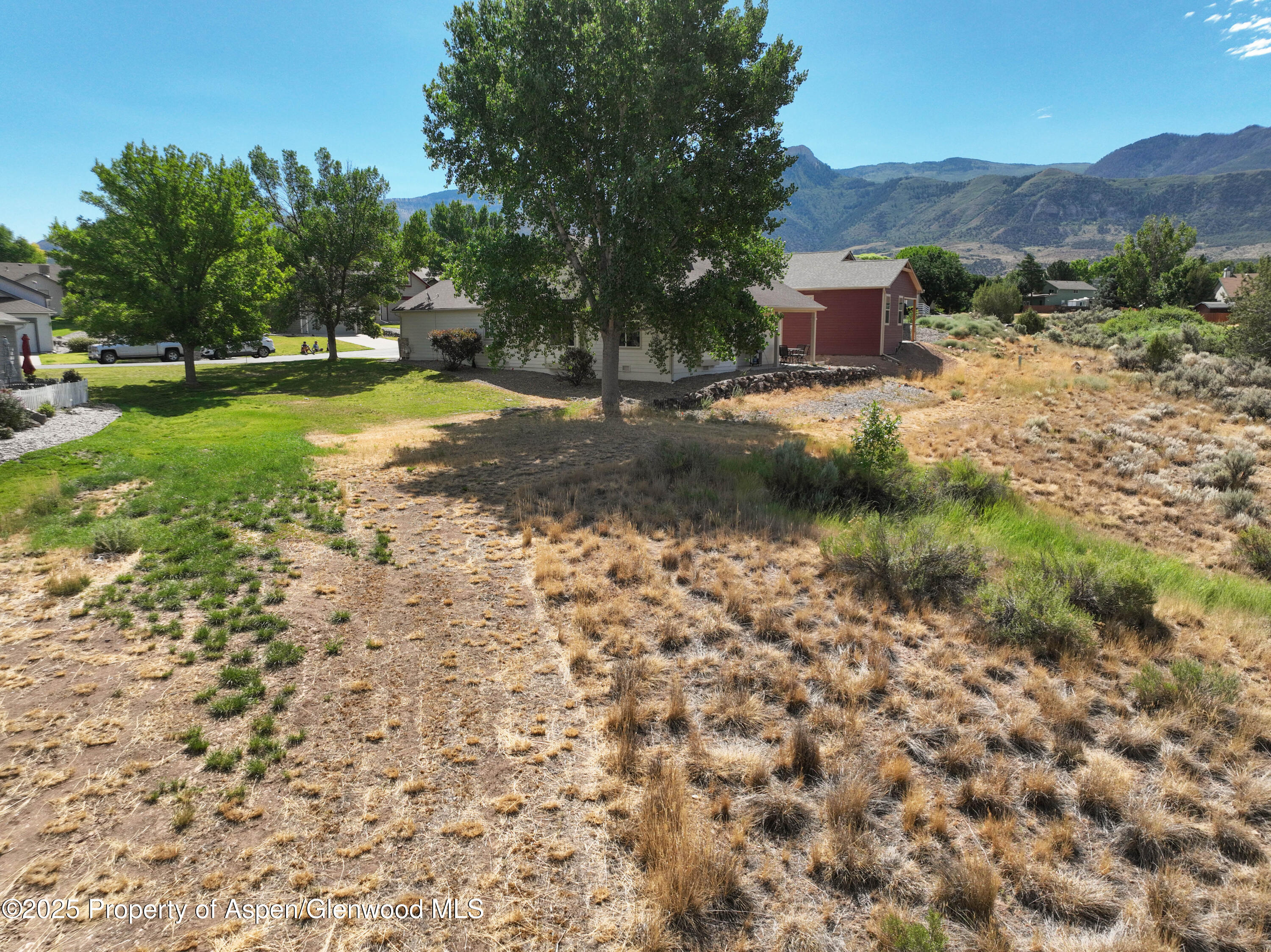 250 Limberpine Circle Battlement Mesa, CO 81635 - Photo 32 of 34 a view of a lake with a mountain