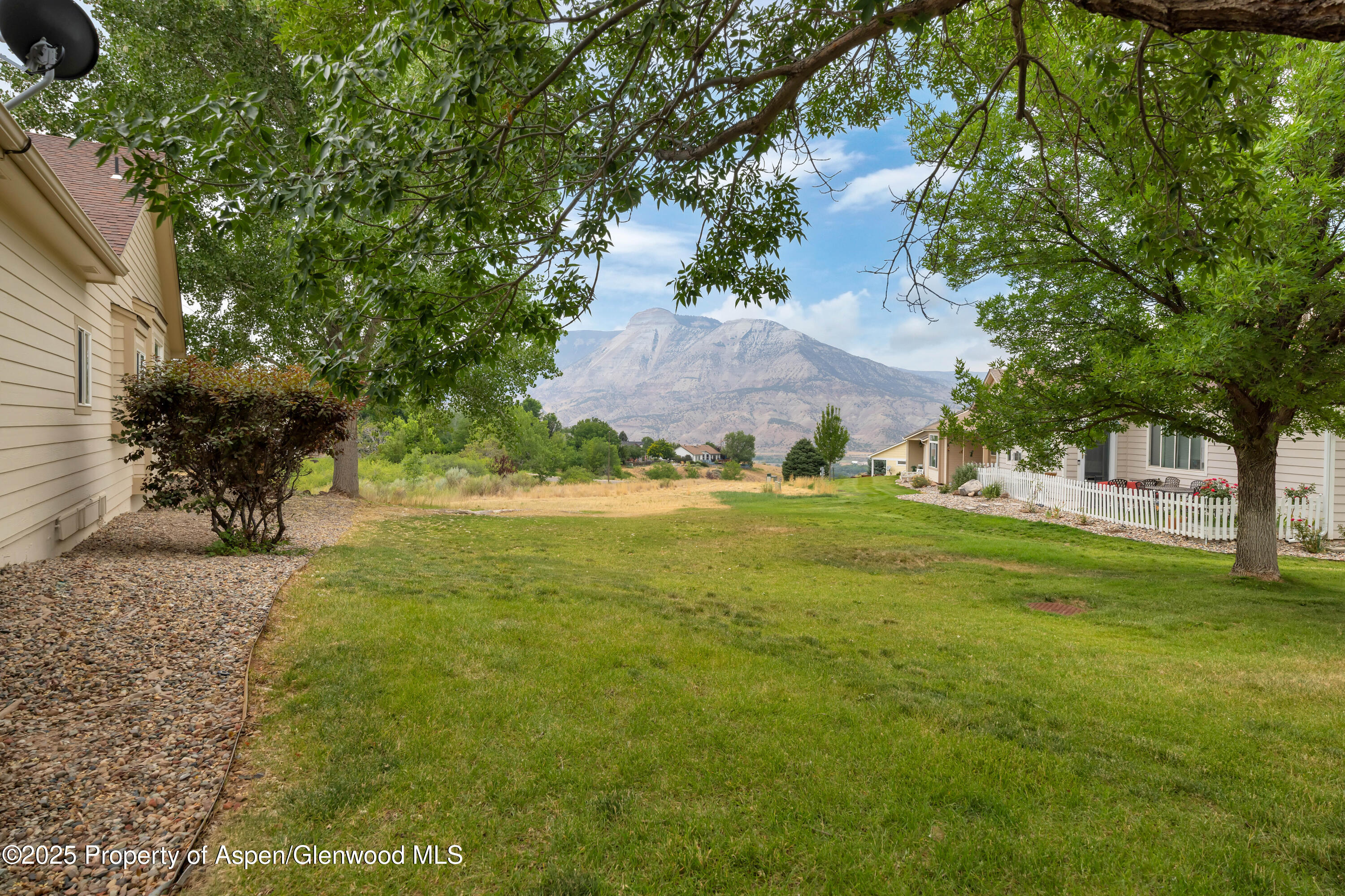 250 Limberpine Circle Battlement Mesa, CO 81635 - Photo 5 of 34 a view of an outdoor space and a yard