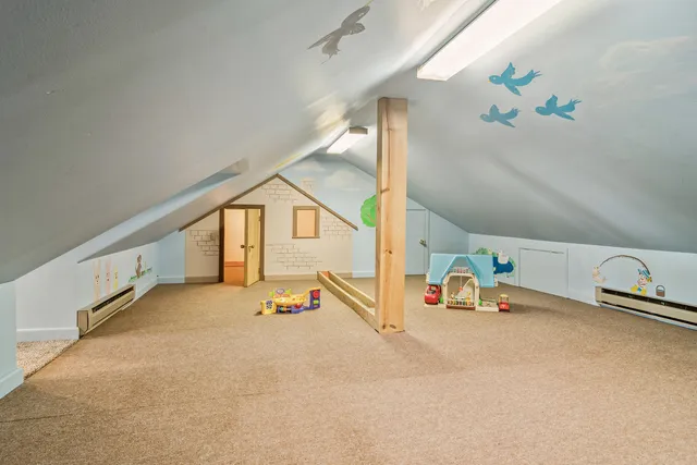 a view of a patio with table and chairs floor to ceiling window and yard