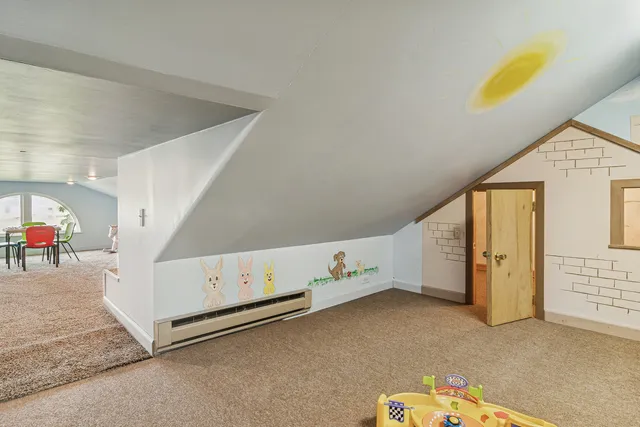 a view of a house with yard and sitting area