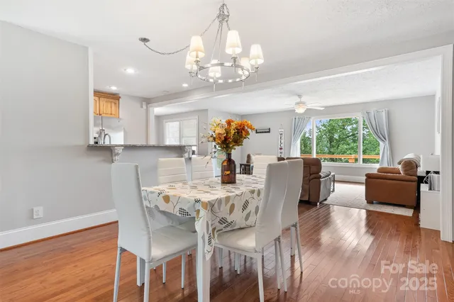 a living room with furniture wooden floor and a window