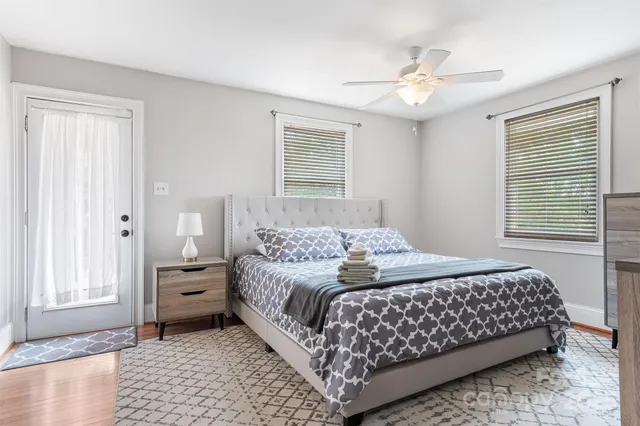 a bedroom with a large bed and a window