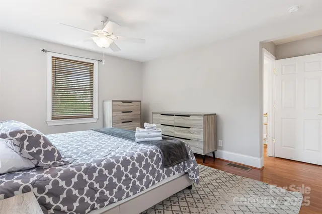a bathroom with a sink mirror and a bathtub