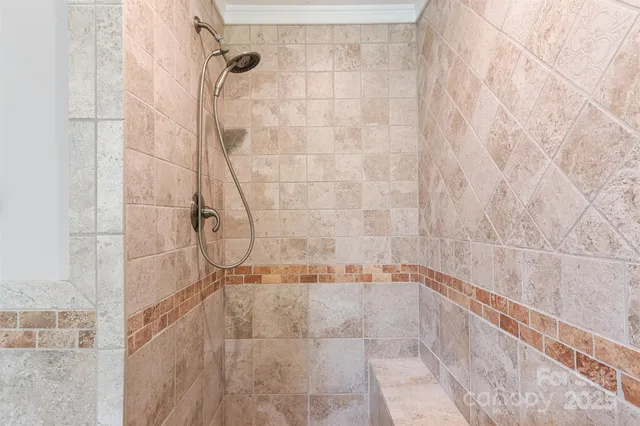 a bathroom with a bathtub a shower and a sink